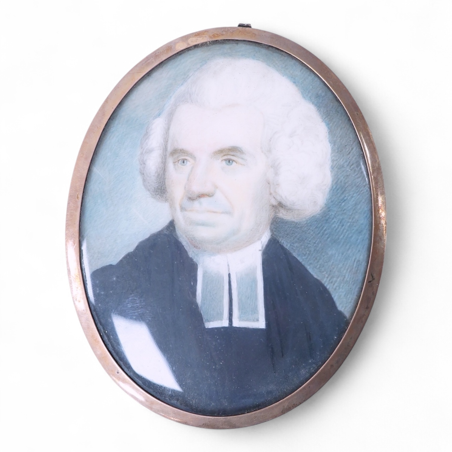 An early 19th century, English School, Portrait of a clergyman, portrait miniature, watercolour on ivory, housed in a gilt metal frame, 7.5cm high CITES Submission reference 2DG4HQ4U